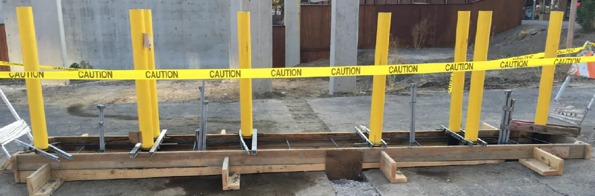 Sloped laneway leveling for parking island